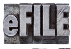 e-file taxes - tax concept - a collage of isolated words in vintage grunge metal letterpress type